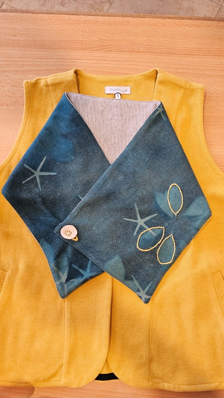 Cozy Collar – teal cyano print, button and embroidered leaves, laid flat – view 3